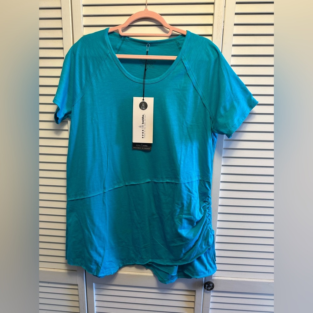 NWT Neon Buddha Medium Tunic Top. PTP 21”. Drawstring side. Asymmetrical Hem